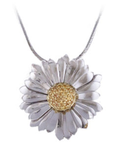 This 18k white gold whimsical “Daisy” with a yellow sapphire center is approximately 1″ in diameter and is a delight to wear. Call for pricing (#230-1541)