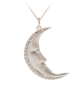 The moon always shines when you wear this 18k white gold pendant accented with 0.15 ctw white brilliant diamonds. Call for pricing (#437-0393)