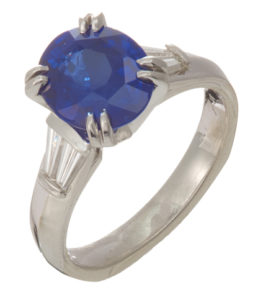 This breathtaking natural blue 3.51 carat sapphire is set in platinum and is accented by tapered diamond baguettes, 0.52ctw. A true stunner! Call for pricing (#200-1583)

