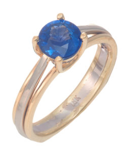 This 18k white and yellow gold ring features a 1.28 carat blue sapphire. Call for pricing (#200-1733)

