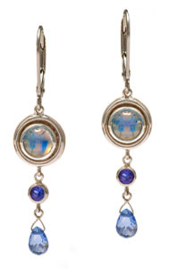 These alluring moonstones, set in 14k white gold, are accented with purple sapphires (0.30 ctw) and light blue sapphire briolettes (1.24 ctw).  These shimmering earrings are approximately 1 3/4″ in length. Call for pricing (#210-1345)

