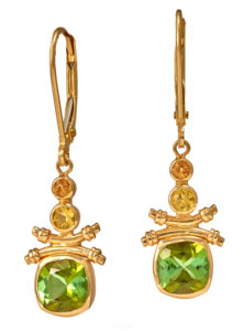 These alluring14 karat yellow gold earrings are set with green tourmalines (1.8 ctw) and orange and yellow sapphires (0.24 ctw).  Call for pricing (#210-1263)

