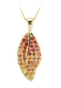 This autumnal 18k yellow gold pendant features colored sapphires (2.47 cwt.) and rubies (.03 ctw). call for pricing (#230-1161)
