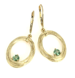 These 14k yellow gold vine earrings nestle beautiful peridots. call for pricing (#210-01369)

