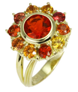 Bursting with energy, this Mexican fire opal and orange sapphire ring is set is 18k yellow gold. Call for pricing (#200-1928)

