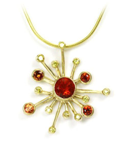 This 18k yellow gold pendant features a Mexican fire opal center stone and circling yellow diamonds (0.18 ctw.) and orange sapphires (042 ctw). call for pricing (#230-01317)
