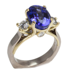 This 18k white and yellow gold ring features a gorgeous 2.4 carat cornflower blue sapphire and .40 ctw of brilliant white diamonds. Call for pricing (#200-1976)