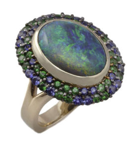 18k yellow gold, black opal ring with tsavorites and sapphires