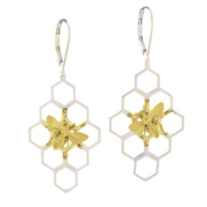 These whimsical sterling silver honeycomb earrings are adorned with a tiny 14k yellow gold honey bee. The earrings are approximately 1 1/4″ in length and 3/4″ in width. Call for pricing (#645-2462)