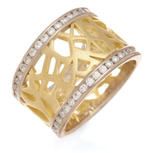 This elegant and bold 18k two toned ring has a yellow gold brushed center and is rimmed with .63ctw round white diamonds which are set in white gold. This ring tapers 1/2″ to 1/4″ top to bottom. Call for pricing (#130-1137)