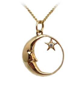This 14k yellow gold smiling moon face is accented with a shining star. Call for pricing (#437-0488)
