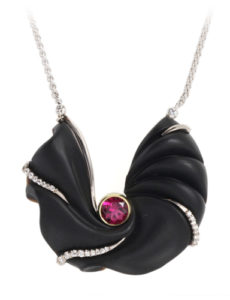 18k white gold pendant featuring an onyx carved by Steve Walters and a red tourmaline