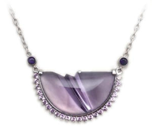 14k white gold and diamond pendant featuring an amethyst carved by Tom Munsteiner
